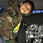 Smile, Camouflage, Military Camouflage, Sleeve, Gesture, Toddler, Flash Photography, Pattern, Military Uniform, Military Person, Comfort, T-shirt, Personal Protective Equipment, Uniform, Soldier, Child, Fun, Vehicle Door, Military Organization, Military, Person, Joy