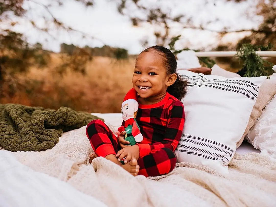 Smile, Facial Expression, Plant, Comfort, Flash Photography, Happy, People In Nature, Grass, Leisure, Toddler, Fun, Recreation, Event, Sitting, Couch, Winter, Baby, Furry friends, Child, Linens, Person, Joy