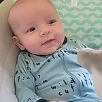 Nose, Face, Cheek, Skin, Smile, Head, Lip, Chin, Eyebrow, Eyes, Mouth, Stomach, Baby & Toddler Clothing, Neck, Human Body, Comfort, Sleeve, Iris, Baby, Finger, Person