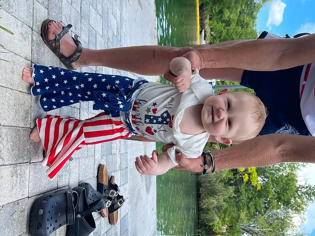Hand, Photograph, White, Gesture, Tree, Flag Of The United States, Sky, Happy, Red, Toddler, Grass, Leisure, People In Nature, Fun, Flag, Camera, Smile, Flag Day (usa), Event, Person, Joy