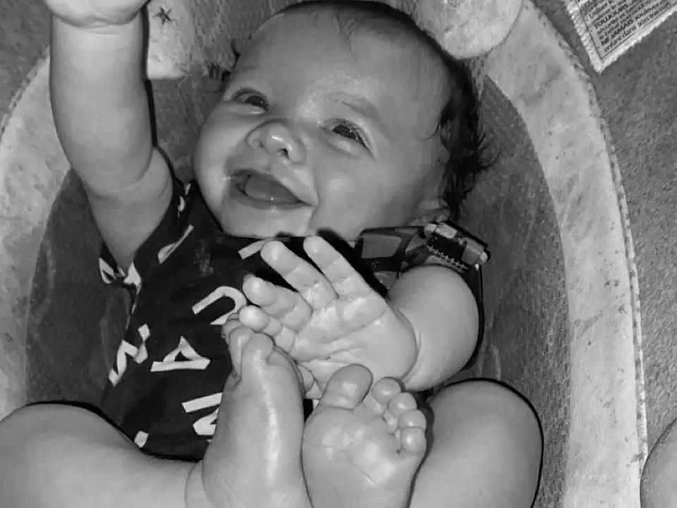 Hand, Arm, Photograph, Smile, Mouth, White, Black, Flash Photography, Baby, Black-and-white, Happy, Iris, Gesture, Style, Finger, Comfort, Toddler, People, Fun, Monochrome, Person