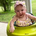 Smile, Baby & Toddler Clothing, Baby Playing With Toys, Happy, Baby, Pink, Yellow, Grass, Toddler, Leisure, Fun, Recreation, Child, Baby Products, Sitting, Fashion Accessory, Headband, Play, Vacation, Riding Toy, Person, Headwear