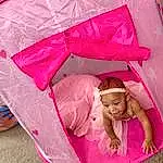 Tent, Purple, Textile, Pink, Material Property, Red, Magenta, Toddler, Tints And Shades, Comfort, Happy, Leisure, Fun, Grass, Fashion Accessory, Child, Recreation, Pattern, Peach, Shade, Person, Headwear