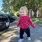 Jeans, Smile, Plant, Hood, Tree, Automotive Lighting, Standing, Grille, Grass, Baby & Toddler Clothing, Toddler, Woody Plant, Asphalt, Fun, Happy, Tints And Shades, Leisure, Road Surface, Electric Blue, Vehicle Door, Person, Joy
