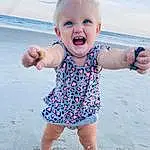 Child, Facial Expression, Toddler, Blue, Skin, Vacation, Head, Summer, Fun, Smile, Pink, Baby, Beach, Sea, Leg, Play, Barefoot, Happy, Sand, Sleeve, Person