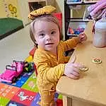 Table, Tableware, Yellow, Toddler, Smile, Fun, Wood, Chair, Baby & Toddler Clothing, Child, Baby, Event, Leisure, Play, Kindergarten, Room, Sharing, Desk, Happy, Person