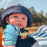 Sky, Cloud, Cap, Happy, Tree, Cool, Grass, Leisure, Toddler, Personal Protective Equipment, T-shirt, Recreation, Electric Blue, Hat, Fun, Child, Sun Hat, Travel, Fashion Accessory, Landscape, Person, Headwear