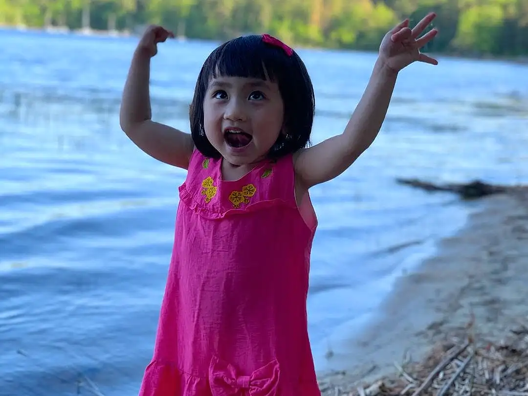 Pink, Facial Expression, Child, Skin, Beauty, Smile, Water, Summer, Vacation, Happy, Sea, Fun, Dress, Photography, Child Model, Play, Toddler, River, Gesture, Person