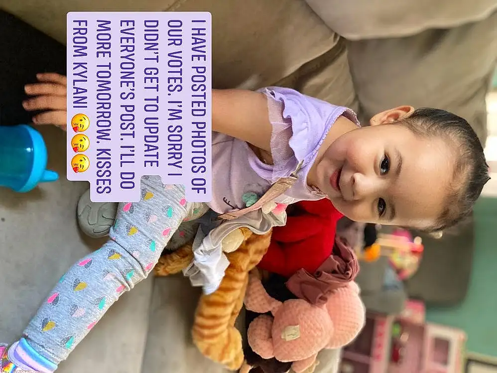 Skin, Smile, Photograph, Blue, Purple, Toy, Baby Playing With Toys, Baby & Toddler Clothing, Textile, Happy, Baby, Toddler, Comfort, Child, Stuffed Toy, Fun, Sitting, Person, Joy