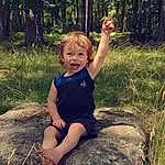 Plant, Ecoregion, People In Nature, Smile, Branch, Natural Environment, Wood, Tree, Happy, Terrestrial Plant, Grass, Woody Plant, Trunk, Toddler, Forest, Fun, Human Leg, Thigh, Child, Person