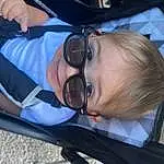 Glasses, Head, Hairstyle, Facial Expression, Mouth, Comfort, Sunglasses, Vision Care, Smile, Eyewear, Goggles, Toddler, Fun, Child, Auto Part, Baby, Leisure, Car Seat, Personal Protective Equipment, Happy, Person