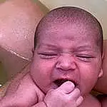 Child, Face, Baby, Skin, Nose, Head, Mouth, Cheek, Forehead, Lip, Hand, Muscle, Finger, Neck, Thumb, Bathing, Person, Sorrow