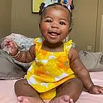 Cheek, Skin, Smile, Hairstyle, Eyes, Facial Expression, Leg, Mouth, Dress, Baby & Toddler Clothing, Comfort, Happy, Finger, Toddler, Fun, Thigh, Child, Thumb, Baby, Barefoot, Person, Joy