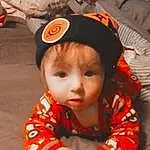 Cheek, Orange, Sleeve, Baby & Toddler Clothing, Toddler, Baby, Child, Fish, Fun, Cap, Fashion Accessory, Costume Hat, Pattern, Sitting, Personal Protective Equipment, Person