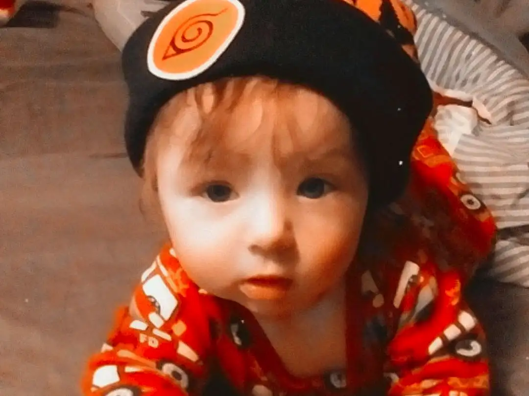 Cheek, Orange, Sleeve, Baby & Toddler Clothing, Toddler, Baby, Child, Fish, Fun, Cap, Fashion Accessory, Costume Hat, Pattern, Sitting, Personal Protective Equipment, Person