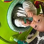Facial Expression, Green, Baby, Baby & Toddler Clothing, Toddler, Fun, Automotive Tire, Child, Baby Products, Happy, Circle, Toy, Play, Baby Toys, Machine, Automotive Wheel System, Baby Safety, Auto Part, Animation, Rim, Person