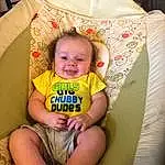 Child, Toddler, Yellow, Skin, Baby, Sitting, Baby Products, Baby & Toddler Clothing, Smile, T-shirt, Person, Joy