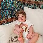 Eyes, Comfort, Smile, Textile, Baby & Toddler Clothing, Happy, Thigh, Flash Photography, Knee, Toddler, Fun, Baby, Pattern, Human Leg, Leisure, Foot, Sitting, Linens, Room, Child, Person, Joy, Headwear