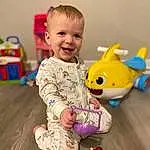 Skin, Smile, Facial Expression, Toy, Baby & Toddler Clothing, Happy, Baby Playing With Toys, Baby, Toddler, Child, Fun, Wood, Room, Play, Baby Toys, Sitting, Stuffed Toy, Baby Products, Plush, Person, Joy