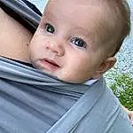 Cheek, Skin, Lip, Eyebrow, Eyes, Eyelash, Baby & Toddler Clothing, Iris, Toddler, Baby, Window, Happy, Blond, Baby Products, Electric Blue, Sitting, Child, Windshield, Vehicle Door, Baby Carriage, Person