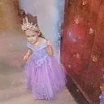 Purple, Dress, Textile, Pink, Happy, Headpiece, Embellishment, Magenta, Art, Baby & Toddler Clothing, Fashion Design, Toy, Toddler, Fun, Event, Fashion Accessory, Peach, Doll, Hair Accessory, Child, Person