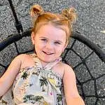 Hair, Skin, Head, Smile, Eyes, Facial Expression, Happy, Iris, Toddler, Summer, Leisure, Fun, Baby & Toddler Clothing, Grass, Recreation, Blond, Bicycle Tire, Child, Sitting, Spring, Person, Joy