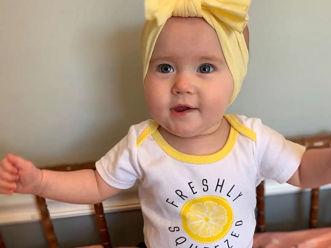 Child, Toddler, Yellow, Baby, Baby & Toddler Clothing, Sleeve, T-shirt, Sitting, Headgear, Child Model, Ear, Costume, Headband, Hair Accessory, Happy, Person, Headwear