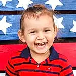 Smile, White, Sleeve, Flag Of The United States, Happy, Gesture, T-shirt, Red, Toddler, Child, Event, Electric Blue, Fun, Flag Day (usa), Baby & Toddler Clothing, Holiday, Flag, Laugh, Room, Person, Joy