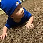 Cap, Yellow, Toddler, Grass, People In Nature, Baseball Cap, Electric Blue, Baby & Toddler Clothing, Soil, Asphalt, Fun, Sand, Shadow, Child, Sitting, Recreation, Beanie, Play, Concrete, Person, Headwear