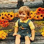 People In Nature, Child, Yellow, Flower, Toddler, Orange, Sunflower, Plant, Leaf, Grass, Sunflower, Summer, Autumn, Sitting, Child Model, Dress, Happy, Fawn, Petal, Wildflower, Person, Joy