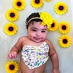 Flower, Skin, Head, Smile, Hairstyle, Photograph, Eyes, Facial Expression, Plant, Green, Blue, Yellow, Baby & Toddler Clothing, Textile, Happy, Orange, Petal, Pink, Person, Joy