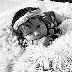 White, Smile, Textile, Happy, Cap, Style, Fur Clothing, Black-and-white, Toy, Headgear, People In Nature, Flash Photography, Grass, Natural Material, Baby, Toddler, Child, Black & White, Monochrome, Furry friends, Person, Headwear