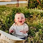 Face, Smile, Plant, Outerwear, Photograph, People In Nature, Baby, Grass, Happy, Wheelbarrow, Baby & Toddler Clothing, Yellow, Toddler, Wood, People, Child, Fun, Leisure, Grassland, Person, Joy