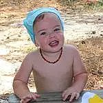Smile, Green, Happy, Finger, Toddler, Fun, Leisure, Child, Chest, Event, Recreation, Sitting, Soil, Play, Laugh, Barechested, Grass, Vacation, Jewellery, Baby, Person