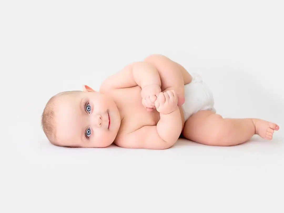 Face, Cheek, Skin, Head, Eyes, Comfort, Baby, Baby & Toddler Clothing, Flash Photography, Toddler, Happy, Baby Sleeping, Foot, Child, Barefoot, Wood, Linens, Human Leg, Portrait Photography, Flesh, Person, Joy