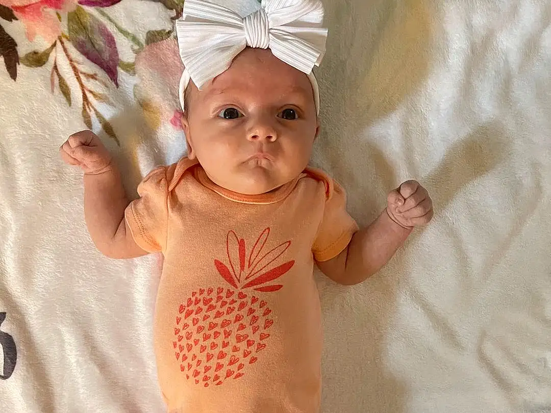 Skin, Head, Leg, Baby & Toddler Clothing, Flower, Plant, Baby, Comfort, Finger, Toddler, Fawn, Headgear, Wood, Rose, Linens, Pattern, Child, Baby Products, Room, Abdomen, Person, Headwear