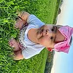 Skin, Plant, People In Nature, Grass, Smile, Happy, Toddler, Sky, Groundcover, Hat, Baby & Toddler Clothing, Leisure, Tree, Baby, Grassland, Child, Fun, Garden, Herb, Shrub, Person, Headwear