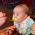 Cheek, Chair, Tableware, Food Craving, Baby, Toddler, Child, Baby & Toddler Clothing, Fun, Biting, Sharing, Sitting, Comfort Food, Thumb, Eating, Person