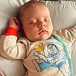 Nose, Cheek, Skin, Chin, Facial Expression, Mouth, Comfort, Baby Sleeping, Neck, Human Body, Textile, Baby & Toddler Clothing, Sleeve, Baby, Stomach, Toddler, Linens, T-shirt, Person