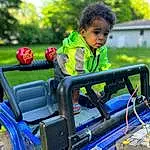 Vroom Vroom, Tree, Automotive Tire, Plant, Grass, Leisure, Fun, Toddler, Summer, Recreation, Playground, Bumper, Engineering, Happy, Automotive Exterior, T-shirt, Electric Blue, Automotive Wheel System, Auto Part, City, Person