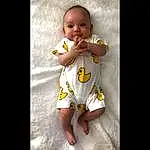 Child, White, Yellow, Toddler, Nose, Baby, Baby & Toddler Clothing, Baby Products, Arm, Joint, T-shirt, Mouth, Hand, Photography, Smile, Sleeve, Person