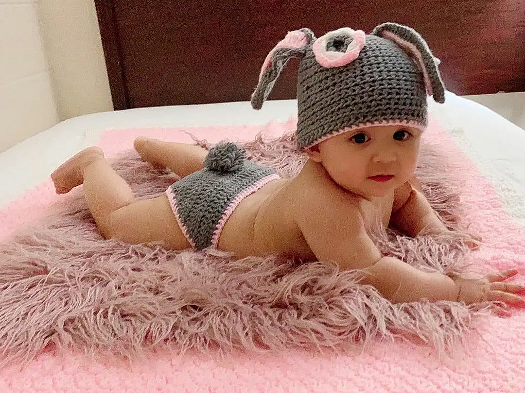 Child, Clothing, Pink, Crochet, Baby, Skin, Beanie, Knit Cap, Headgear, Toddler, Furry friends, Cap, Knitting, Costume Accessory, Wool, Hat, Ear, Photography, Hair Accessory, Dress, Person, Headwear