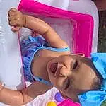 Arm, Facial Expression, White, Mouth, Blue, Purple, Pink, Yellow, Water, Finger, Happy, Fun, Toddler, Leisure, Summer, Baby & Toddler Clothing, Child, Beauty, Magenta, Person