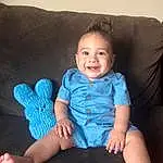 Face, Skin, Smile, Arm, Leg, Couch, Comfort, Sleeve, Baby & Toddler Clothing, Gesture, Finger, Flash Photography, Thigh, Lap, Happy, Electric Blue, Sock, Human Leg, Toddler, Foot, Person, Joy