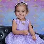 Smile, Skin, Hairstyle, White, Purple, Dress, Blue, Baby & Toddler Clothing, Standing, Pink, Iris, Violet, Happy, Magenta, Day Dress, Toddler, One-piece Garment, Flash Photography, Embellishment, Child, Person, Joy