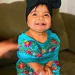 Face, Hair, Smile, Skin, Head, Chin, Hand, Eyes, Facial Expression, Dress, Azure, Human Body, Baby & Toddler Clothing, Neck, Sleeve, Happy, Cap, Finger, Pink, Day Dress, Person, Joy