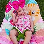 Face, Skin, Head, Eyes, Facial Expression, Smile, Leg, Purple, Comfort, Happy, Dress, Sleeve, Textile, Baby & Toddler Clothing, Pink, Grass, People In Nature, Leisure, Magenta, Thigh, Person, Headwear