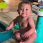 Skin, Smile, Green, Toddler, Baby, Wood, Leisure, Fun, Thigh, Foot, Child, Happy, Human Leg, Sitting, Barefoot, Grass, Thumb, Play, Baby Products, Person, Joy