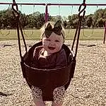Swing, Playground, Toddler, Leisure, Grass, Baby, People In Nature, Fun, Tints And Shades, City, Sky, Outdoor Play Equipment, Child, Shade, Recreation, Happy, Play, Soil, Eyewear, Sitting, Person, Headwear
