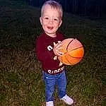Smile, Basketball, Sports Equipment, People In Nature, Flash Photography, Ball, Gesture, Happy, Plant, Grass, Football, Tree, Sports Toy, Toddler, Fun, Child, T-shirt, Soccer Ball, Sitting, Play, Person, Joy